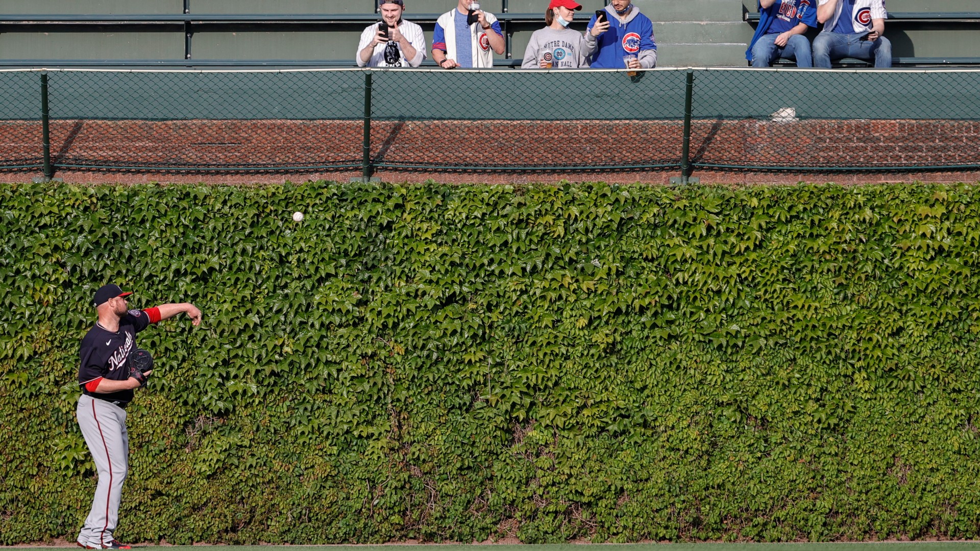 Jon Lester warms up at Wrigley Field