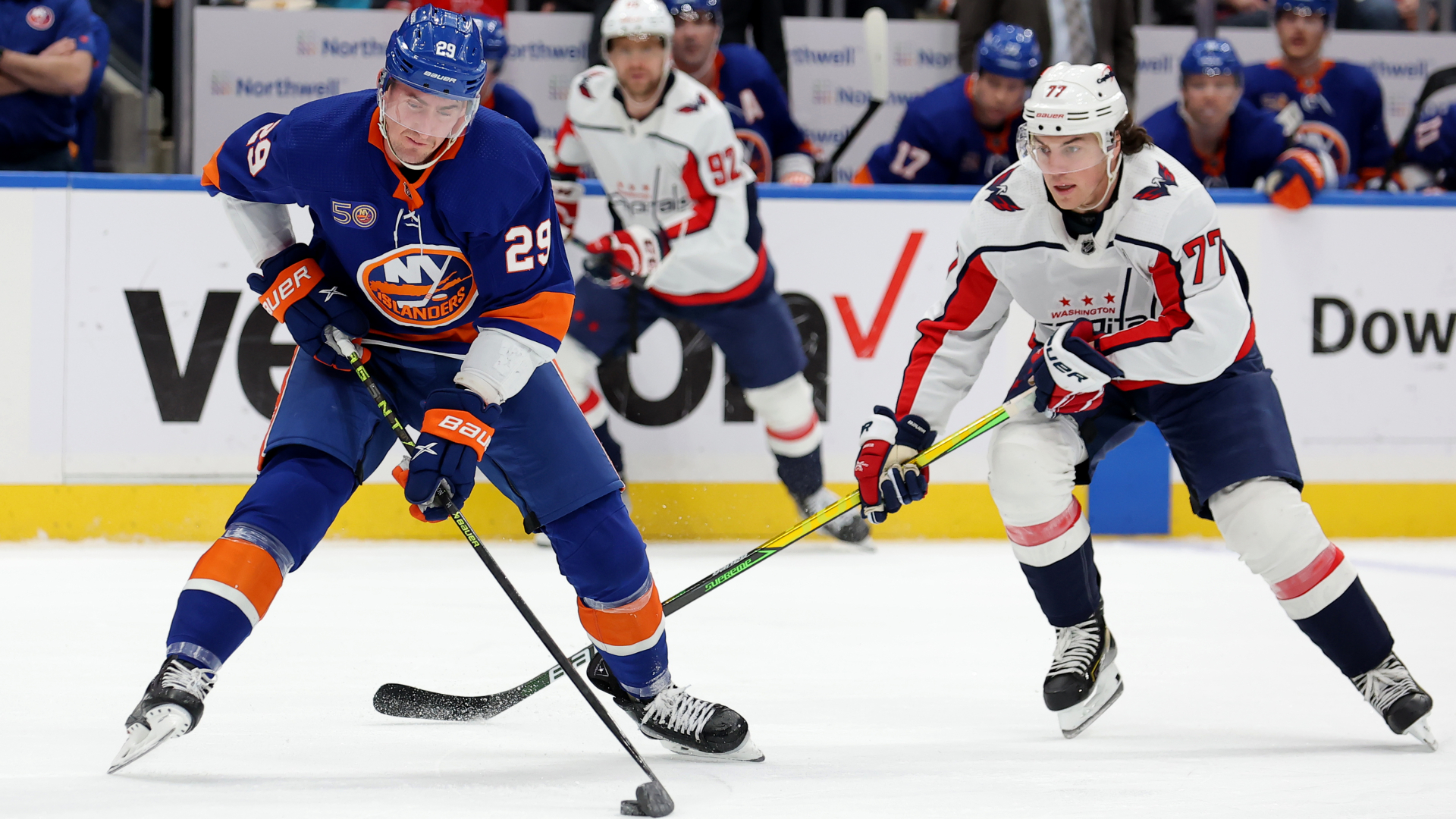 Islanders center Brock Nelson controls the puck against Capitals right wing T.J. Oshie during the second period at UBS Arena