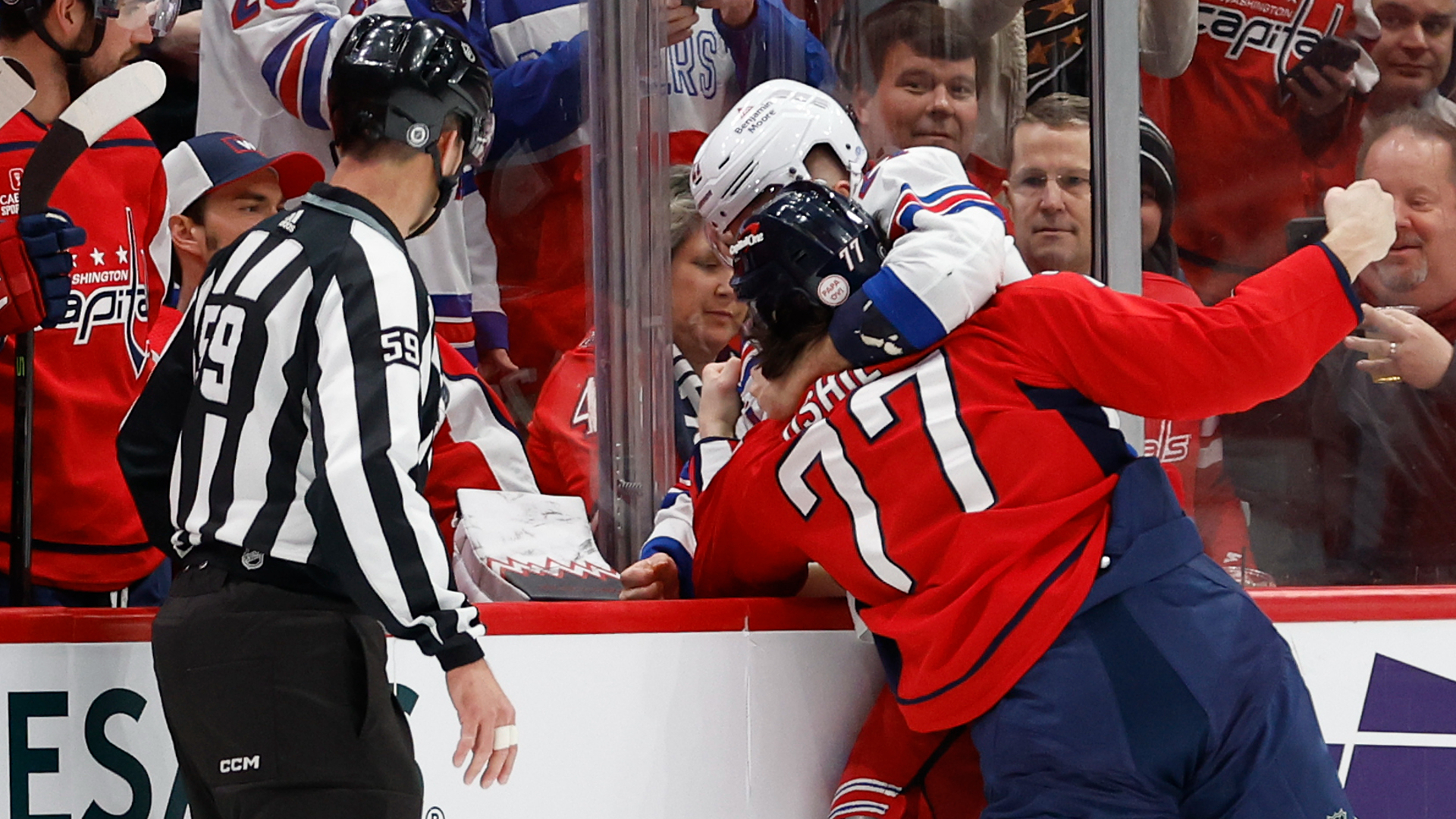 Capitals right wing T.J. Oshie fights Rangers center Barclay Goodrow