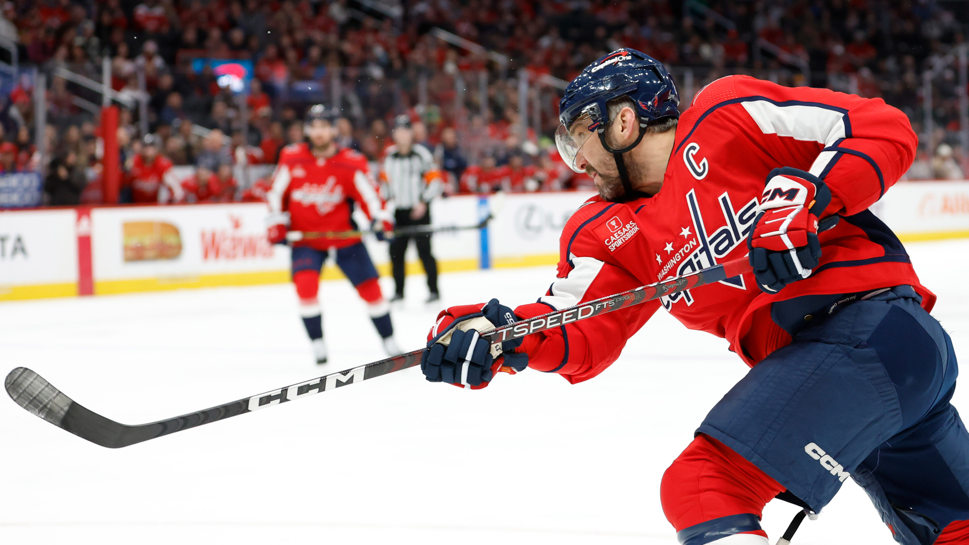Capitals left wing Alex Ovechkin shoots the puck against the Wild